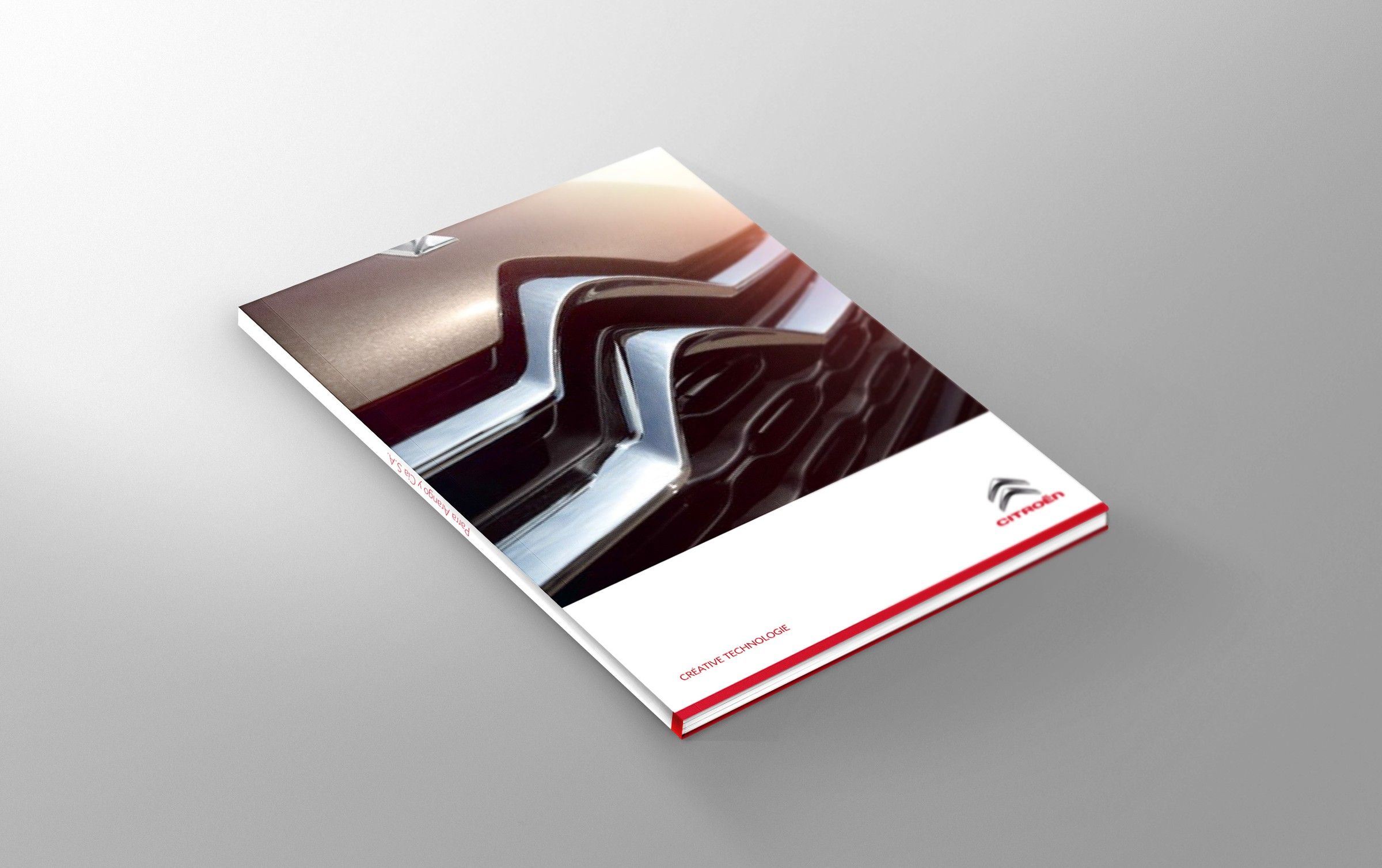 Closed brochure with a close-up of the chrome chevrons on the cover