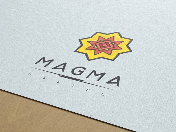 Magma Hostel logo, a yellow and red star above the wordmark, printed on paper