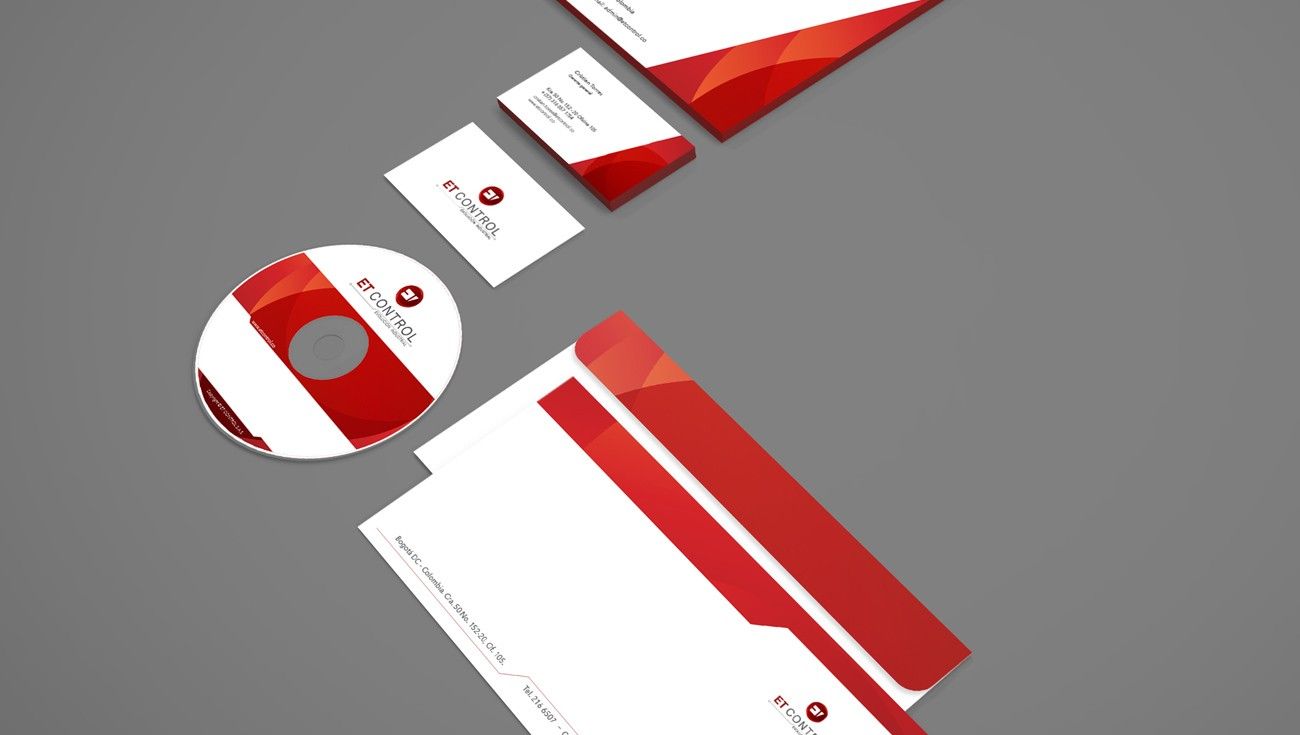 Red and white stationery including a disc, cards and envelopes