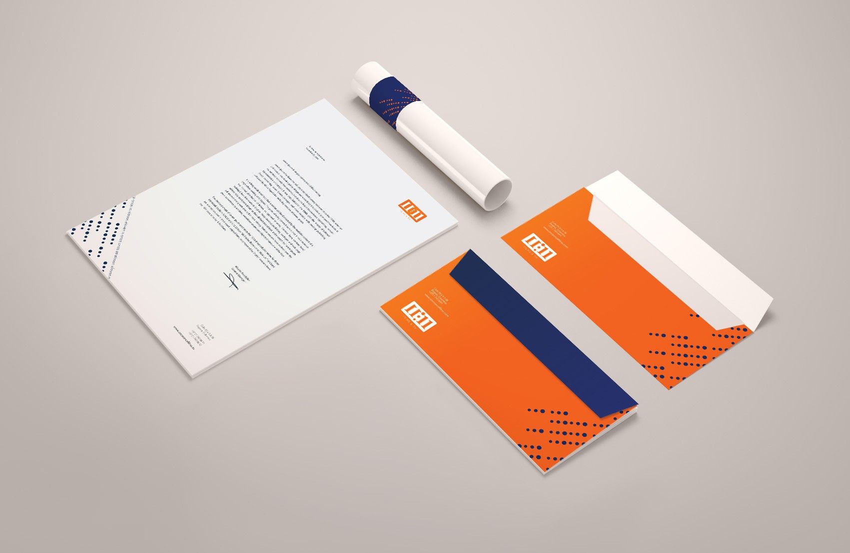 Orange and navy letterhead, envelopes and poster tube with the 11:11 logo