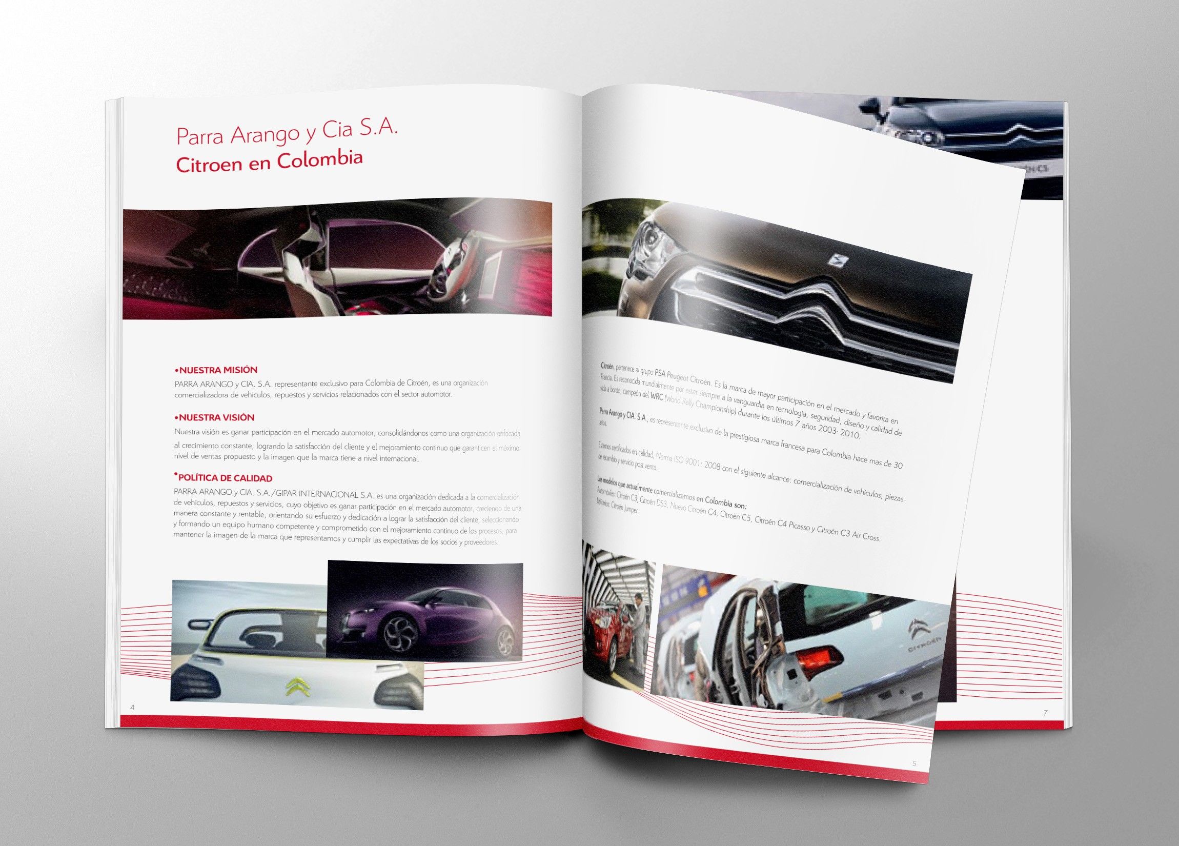 Open brochure with company values beside photos of cars and details