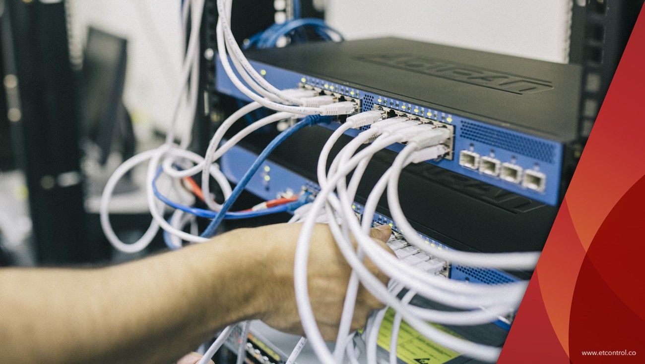 Hands patching network cables in a server rack, with a red brand graphic