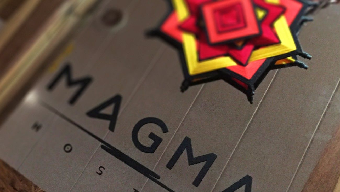 Close-up of a dimensional Magma sign with the red and yellow star
