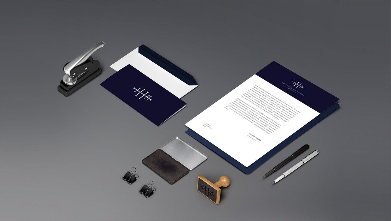 Navy and white stationery set with a stamp and pens