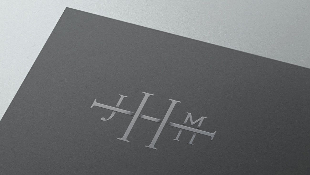 Monogram embossed on grey card