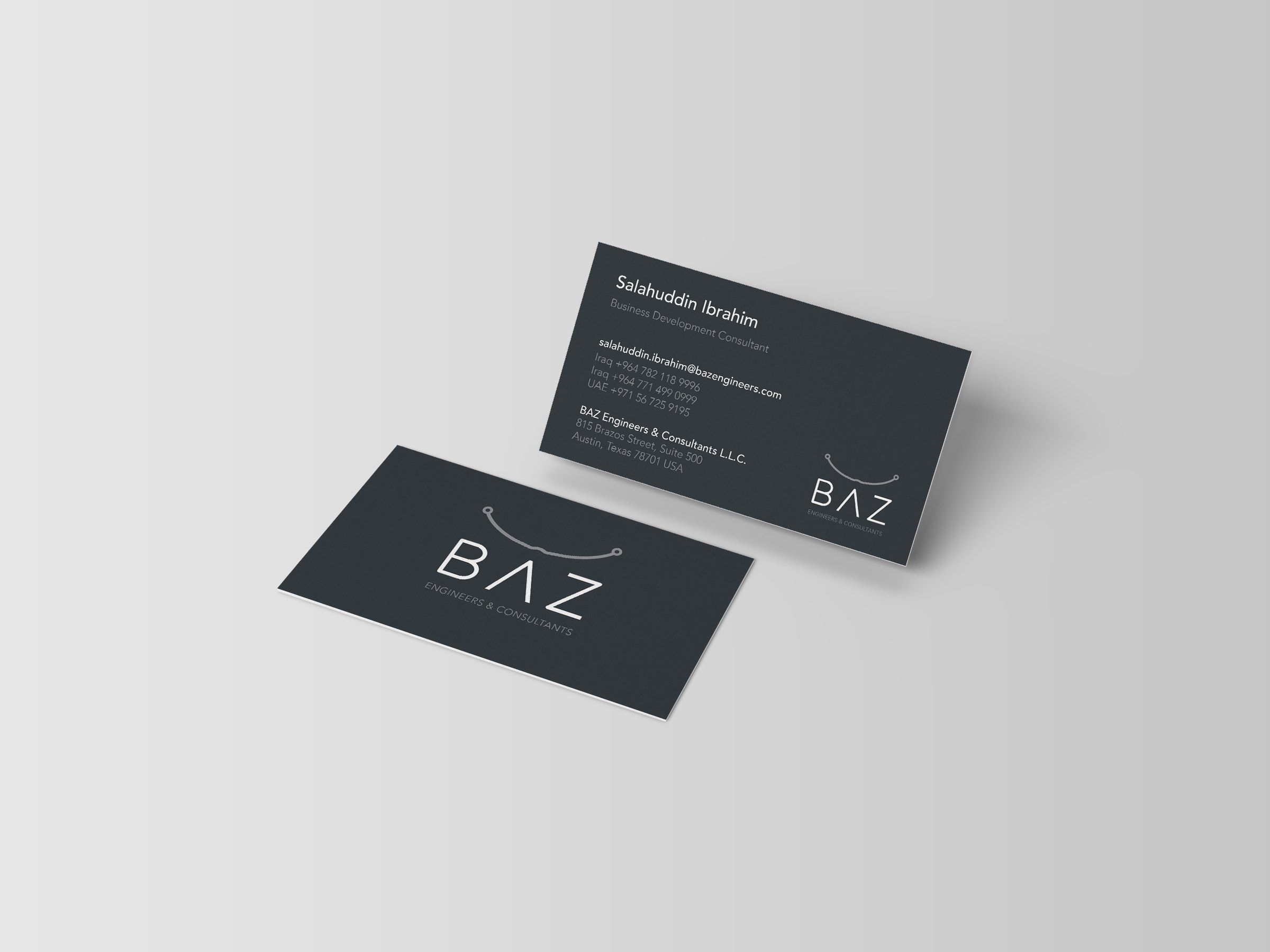 Charcoal BAZ business cards with the logo and contact details